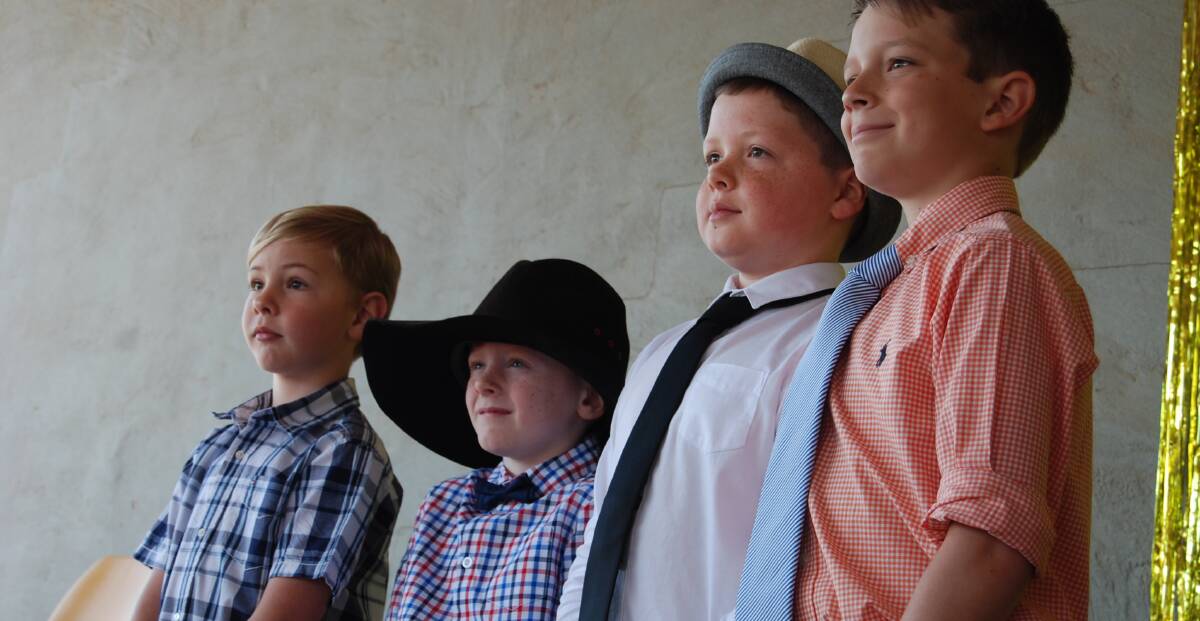VERY SMART: The boys line up for the judging of "Master Juvenile" in the tiny tots and little miss competitions last year. This is always a popular event. Photos: GRACE RYAN. 
