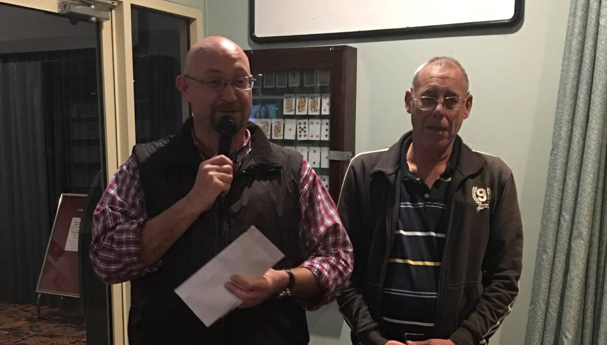 Narromine MS Support Group's Tim McGrath with Bowling Club President Kevin Rider last Tuesday at the monthly trivia.