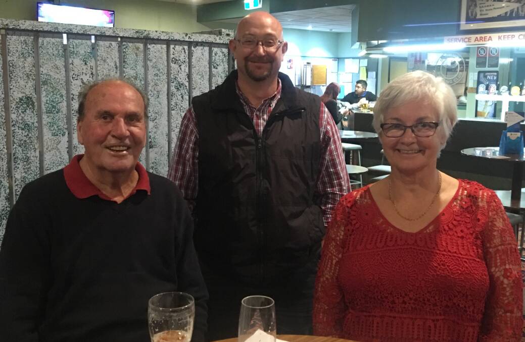 Bogan Bar Flies Warren and Glenys Core with MS Support Group's Tim McGrath during last month's trivia.