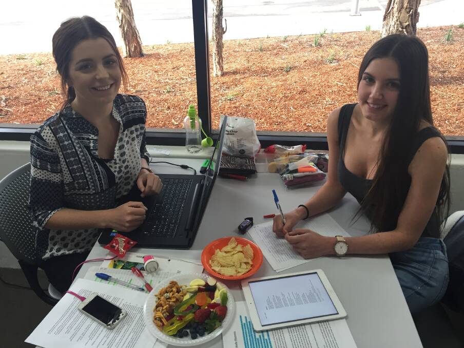 Bega High students Kaytlen Walsh and Alysha Troy prepare for their HSC exams at the Bega Library Lockdown last year. 