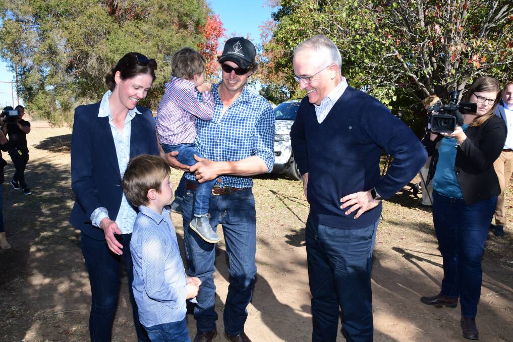 RELIEF: Farmers Ashlea and Phil Miles with children Harry and Jack greeting Malcolm Turnbull. Photo: BELINDA SOOLE
