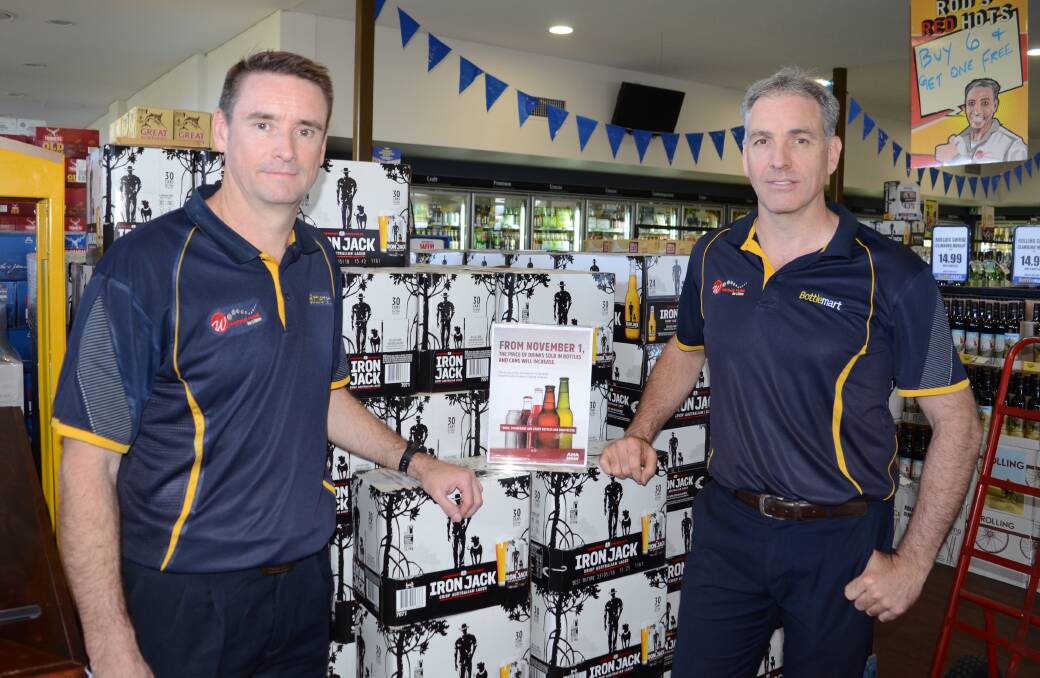 Going up: Westside Hotel Bottleshop manager Gerard Allen and licensee Rod Webster are frustrated the container deposit scheme will drive up the price of beer. Photo: MARK RAYNER