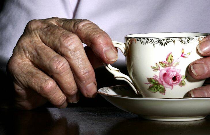 AFR FIRST USE ONLY. old age generic for afr --- generic health , retirement , elderly , nursing homes , aged care , home care. Photo by ROB HOMER SPECIALX 60305

holding a cup and saucer