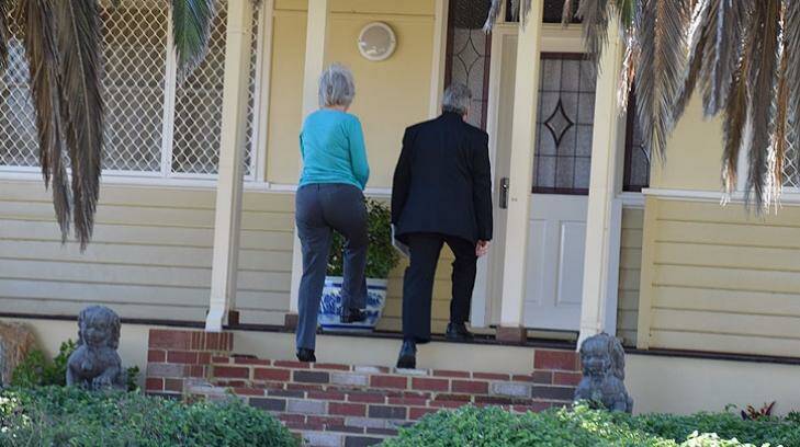Child protection officers arrive at the South Bunbury home. Photo: James Taylor