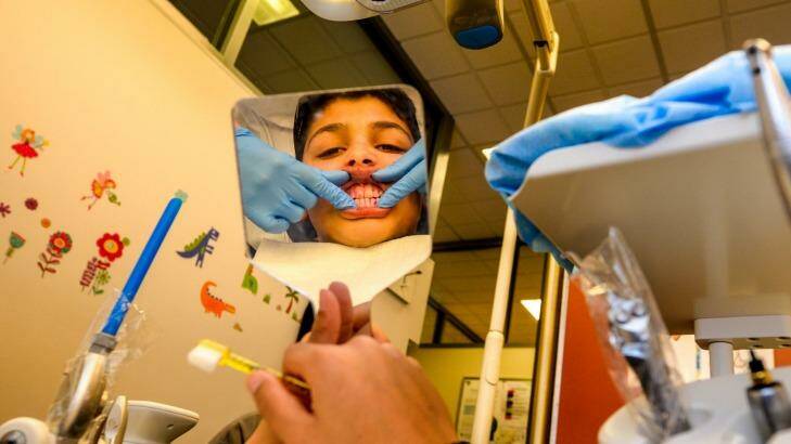 Adam Ayad, aged 12,  being treated at the Royal Melbourne Dental Hospital. Photo: Penny Stephens