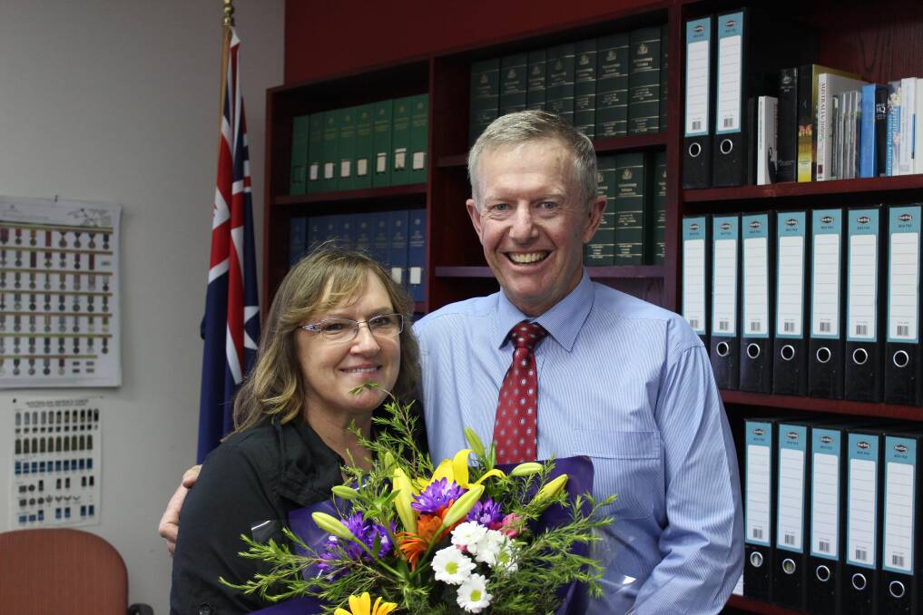 Federal Member for Parkes Mark Coulton congratulates the manager of his Dubbo office Evelyn Barber on 20 years of service. 	Photo: CONTRIBUTED