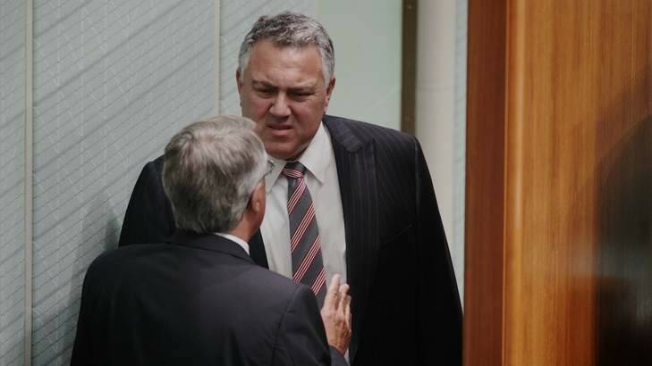 Acting Prime Minister Wayne Swan speaks with Shadow Treasurer Joe Hockey behind the Speaker's chair in Question Time. Photo: Alex Ellinghausen / Fairfax