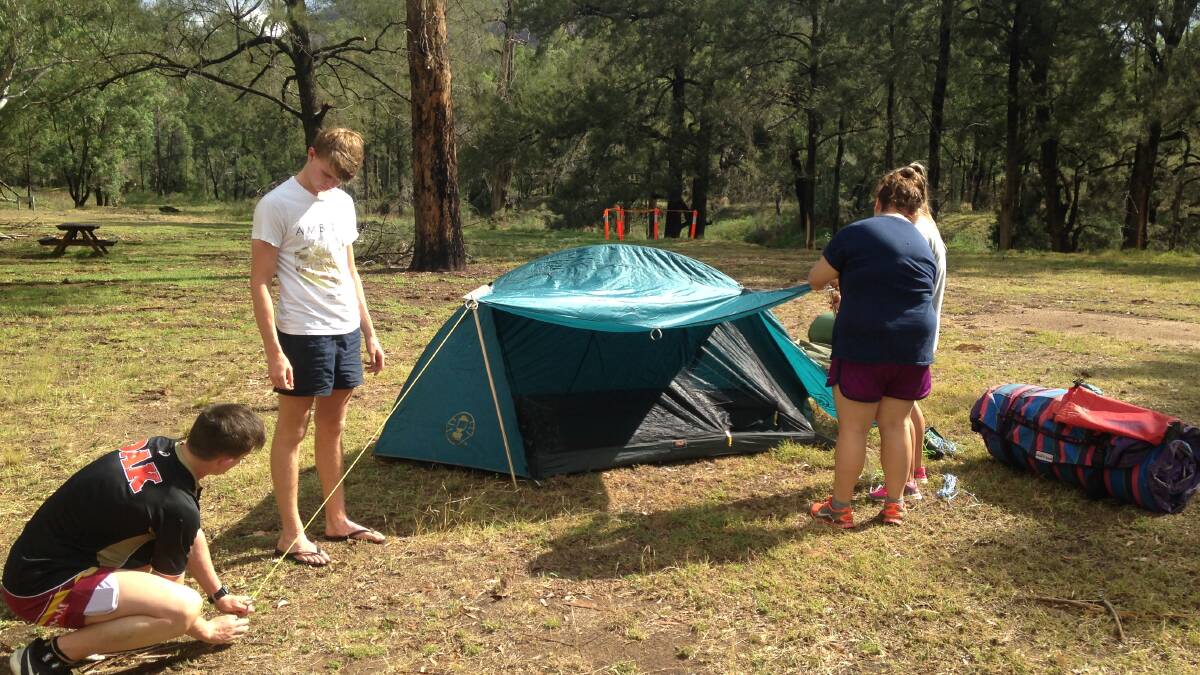 Biology/SLR students Isaac Thompson, Brad Simmons, Maddilen Brennan and Lily Spackman erecting their tents.