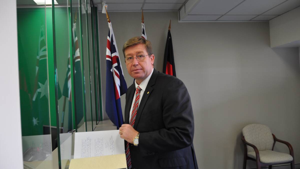 Troy Grant with the Condolence Book.