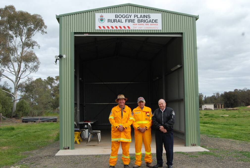 Captain Andrew Flinn, Group Captain Gordon Heckendorf and Orana Team Manager Inbspector Lyndon Wieland in front of the new shed.
