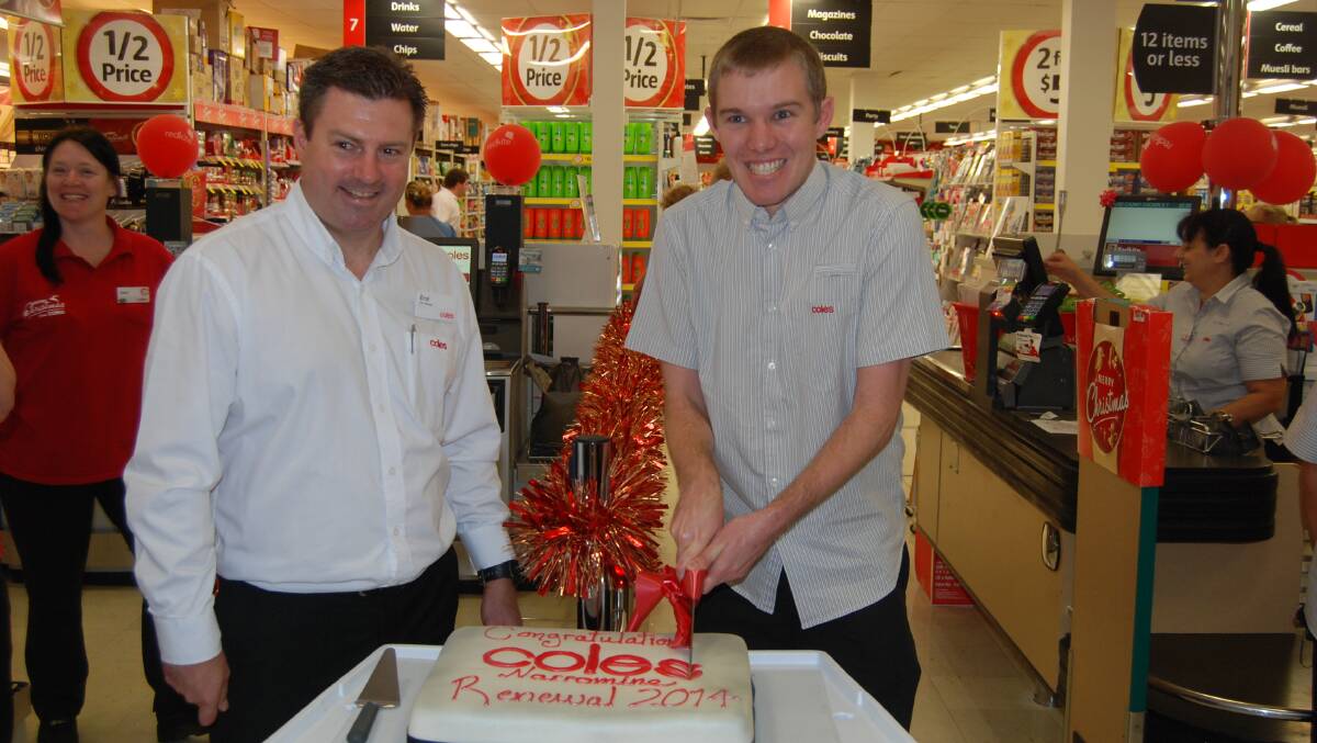 Cutting the cake to celebrate the refurbished Coles.