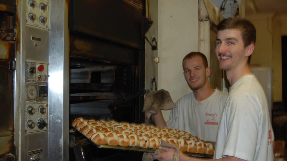 Doug Gillette and Jakob Brennan inspect the mini hot cross buns. Photo: GRACE RYAN