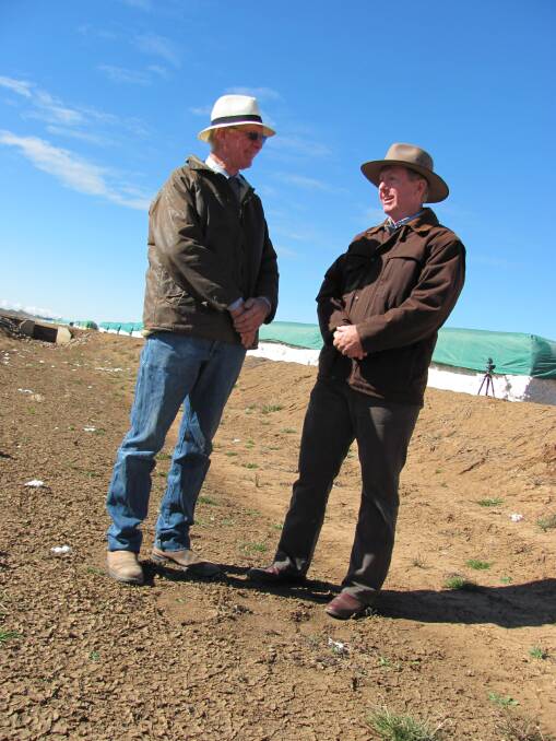 o Federal Member for Parkes Mark Coulton discussing the future of agriculture with Warren cotton grower Tony Wass.