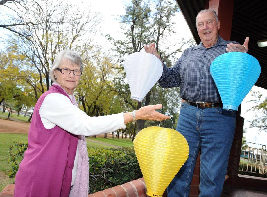 Robyn Stack and Keith Beacroft display lanterns for Dubbo's inaugural Light the Night event, a Leukaemia Foundation initiative to fund projects in hospitals and research facilities. Photo: BELINDA SOOLE