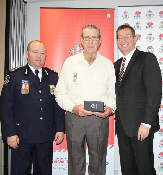NSW Rural Fire Service Commissioner Shane Fitzsimmons, Tony O'Malley and Dubbo MP Troy Grant at the awards ceremony in Dubbo. Photo contributed.