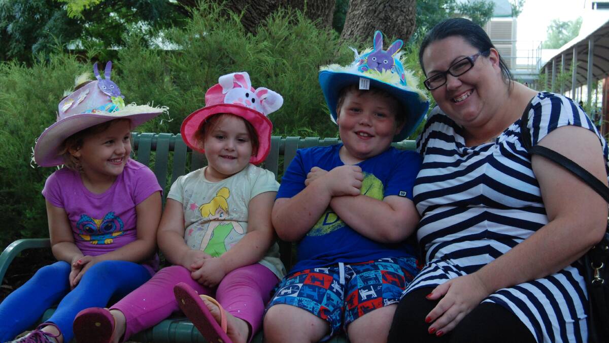 NARROMINE PUBLIC SCHOOL EASTER HAT PARADE: Hayley, Maddison and Jayden are excited for the Easter Bunny to visit with Aunty Anne Grilk