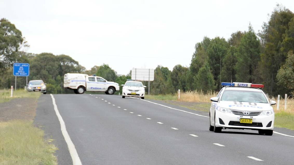 Police took a wanted man into custody west of Dubbo on Tuesday morning