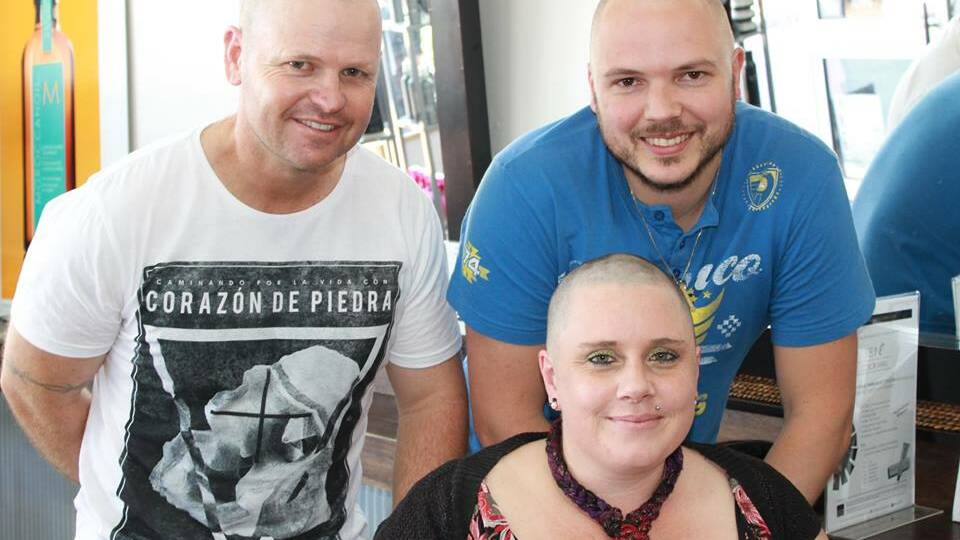 Sacha with her husband and brother-in-law who also shaved their heads.