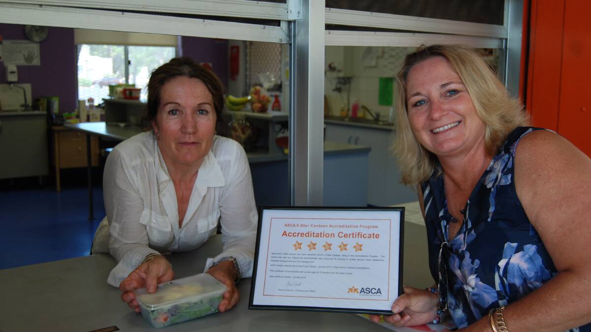 Narromine Public School canteen manager Claire Mears and principal Denise King celebrate the ASCA's 5 Star Accreditation. Photo: STEPH KONATAR