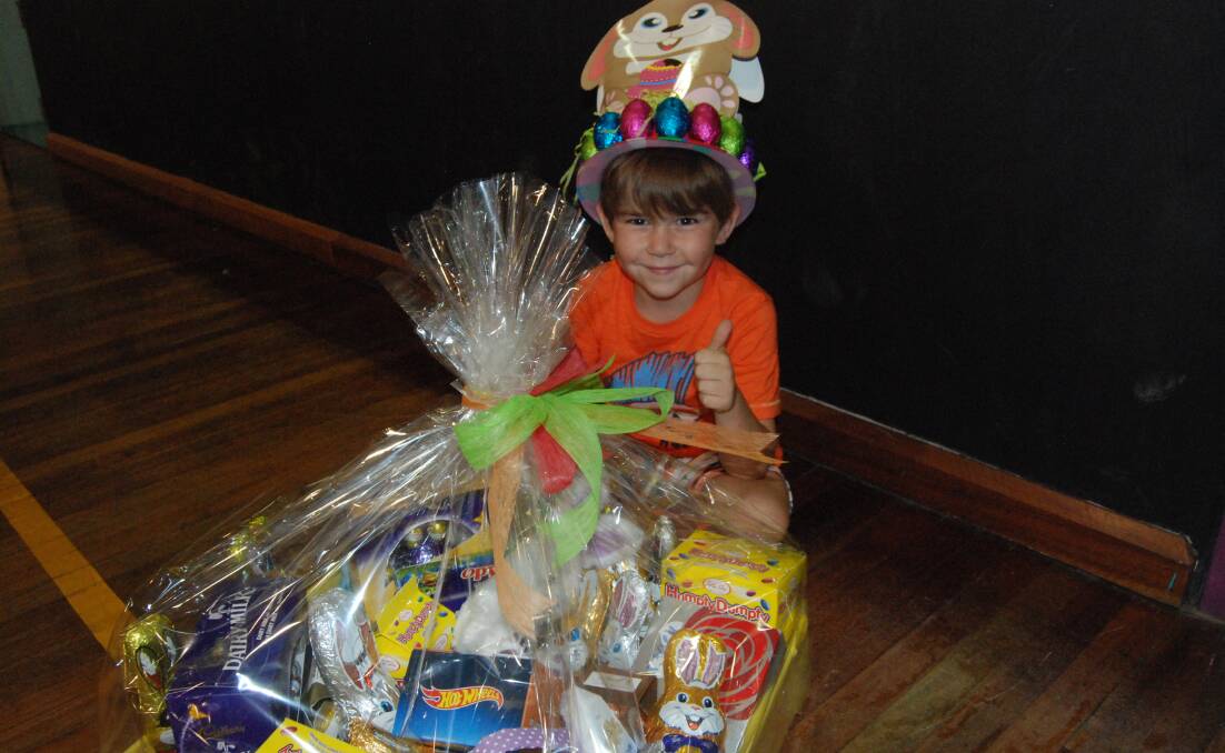 NARROMINE PUBLIC SCHOOL EASTER HAT PARADE: Harley Bender was thrilled Nanny Rhonda Luther won the big prize in the Easter raffle