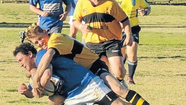 Tigers fullback Simon McCutcheon goes in for the tackle against Yeoval last year.