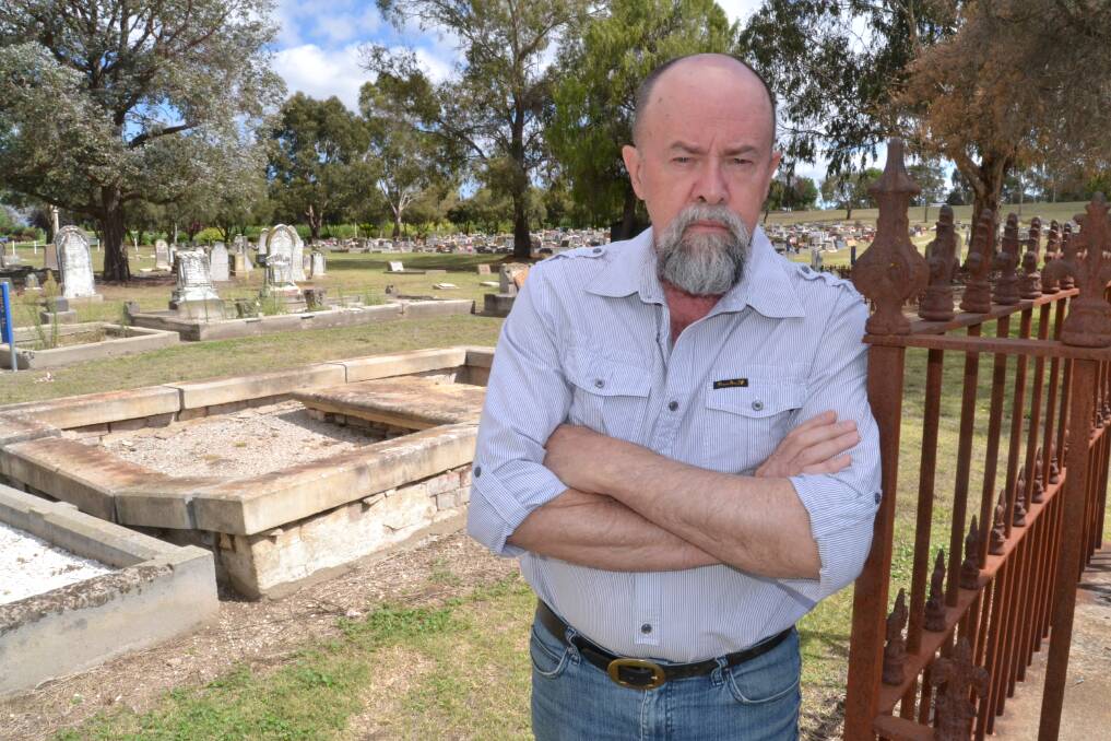 PRICE HIKES: Peter Dowling at Bathurst cemetery.  021714cemetery2