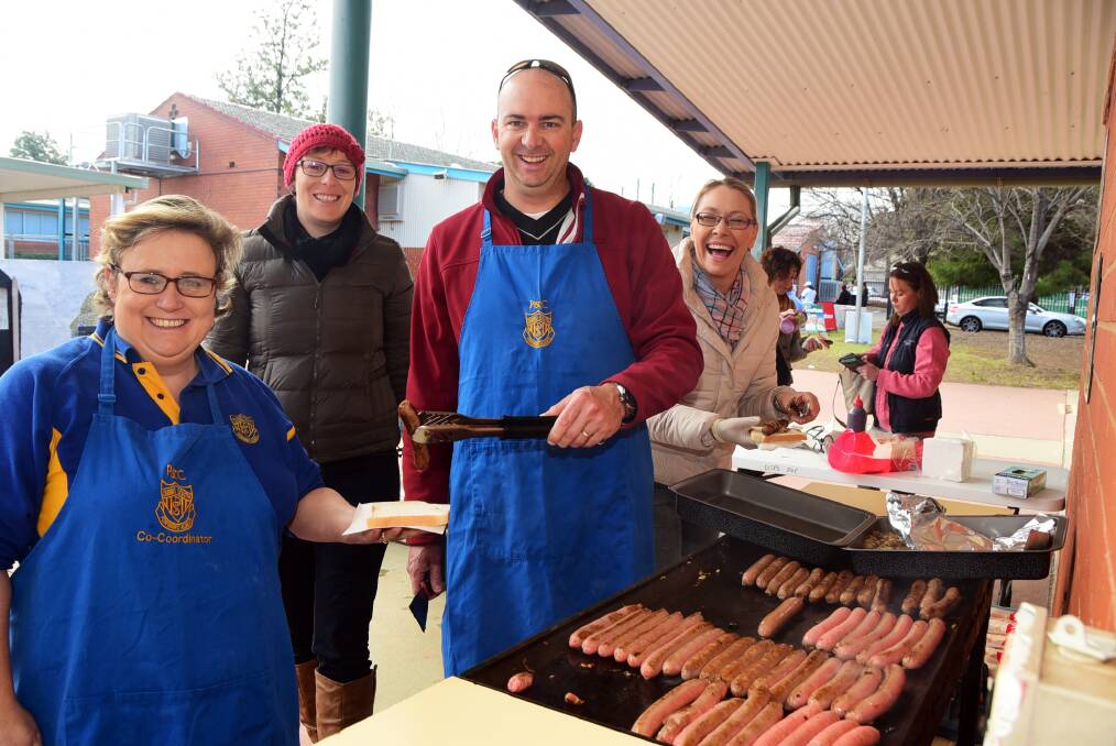 DEMOCRACY SAUSAGE: Manning the sausage sizzle at Dubbo South Public School were canteen manager Jodie Bruce, parent helper Natalie Waghorn, P&C president Rodney Price and vice president Kate Rufus. Photo: Belinda Soole