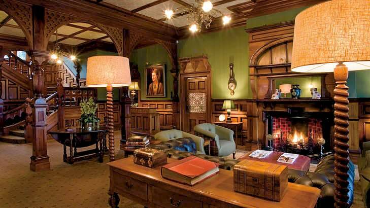 The warm and welcoming Otahuna Lodge lobby at Tai Tapu is filled with antiques. Photo: Stephen Goodenough