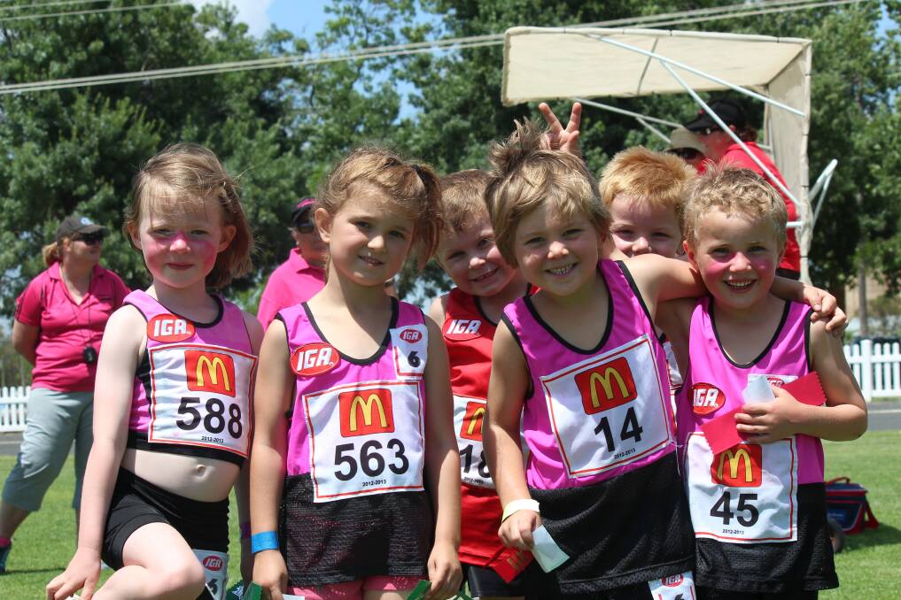 o Narromine’s youngest little athletes celebrate following their 100m race: Ellie Davies, Jocelyn Ward, Lachlan Hollingworth and Jack Wilson.