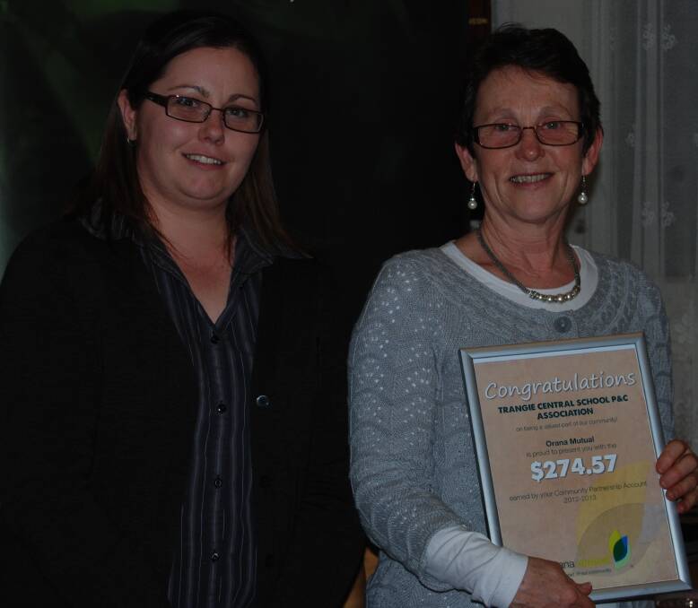 o Lauren Janhsen presenting Trangie Central School Principal Anne Holden with a certificate for money donated to the P&C.