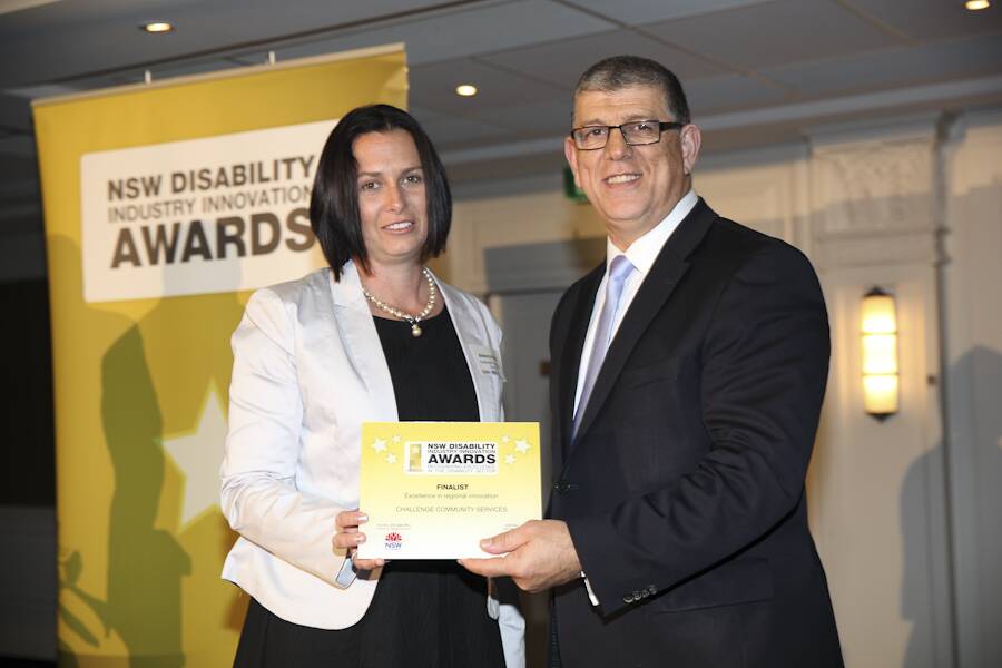 Minister for Disabilities, Hon. John George Ajaka, presented Challenge Trangie Supervisor Rebecca Robb with the finalist for Excellence in Regional Innovation award.