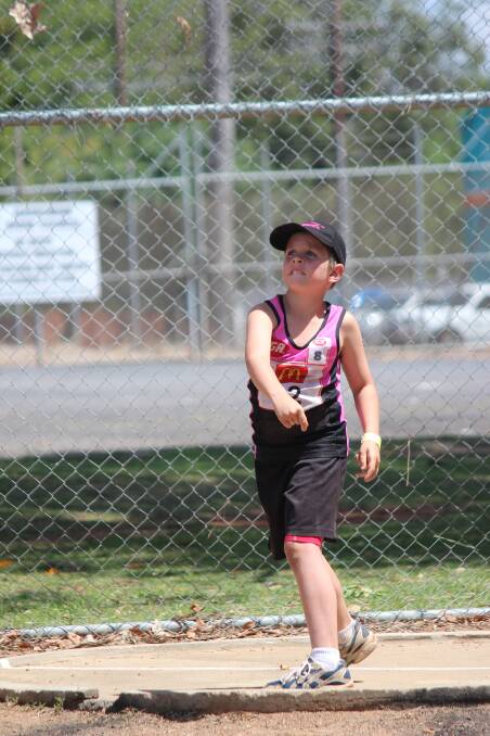 Narromine’s Will Dennis competing in the U8 Boy’s Shot Put event.