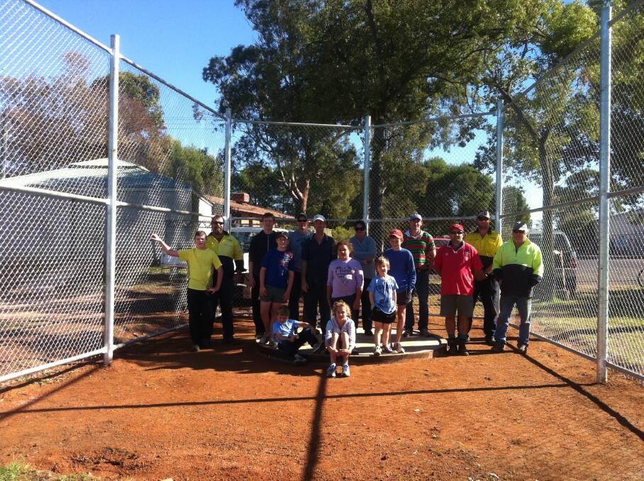 o The many helpers pictured with the finished discus cage.