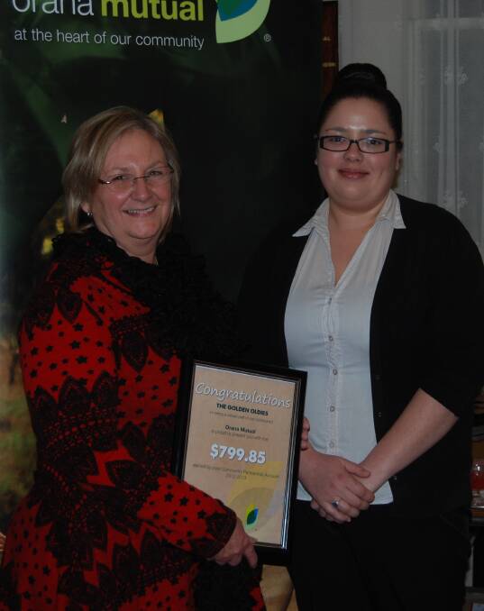 o Jaye Milgate receiving the certificate on behalf of the Trangie Golden Oldies from Candace Baker.