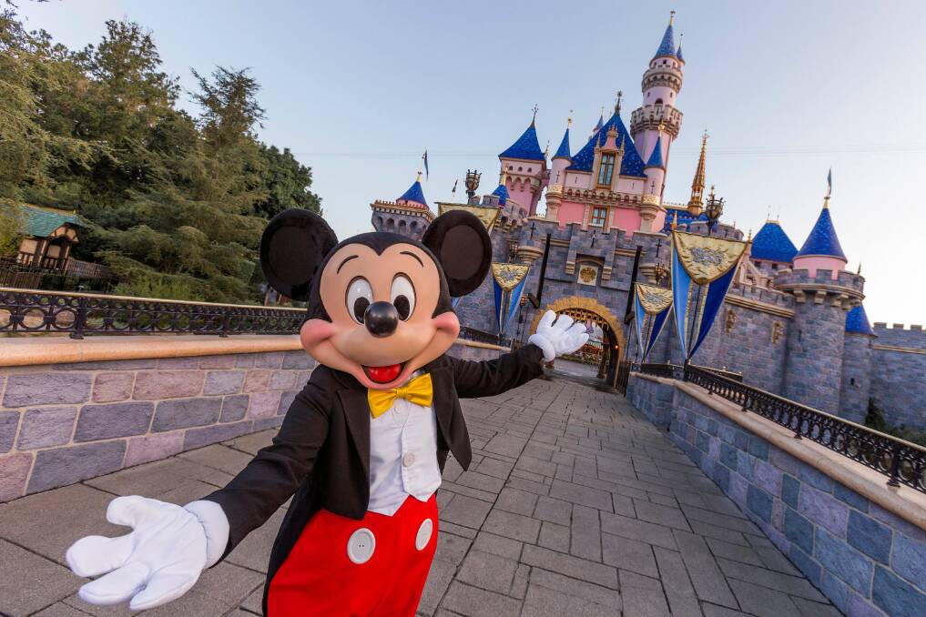 Mickey Mouse poses in front of Sleeping Beauty Castle at Disneyland in California. Picture: Getty Images Mickey Mouse poses in front of Sleeping Beauty Castle at Disneyland in California. Picture: Getty Images