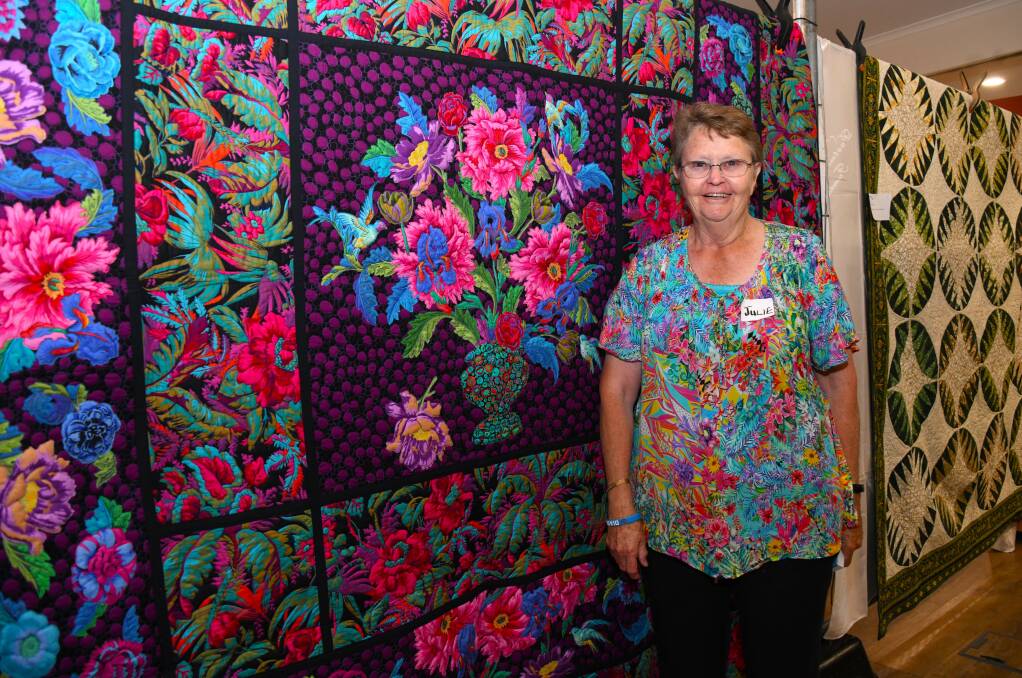 Julie McLane with her Tropical Miuayga quilt at the Macquarie Sewcialites' first quilt show. Picture by Amy McIntyre