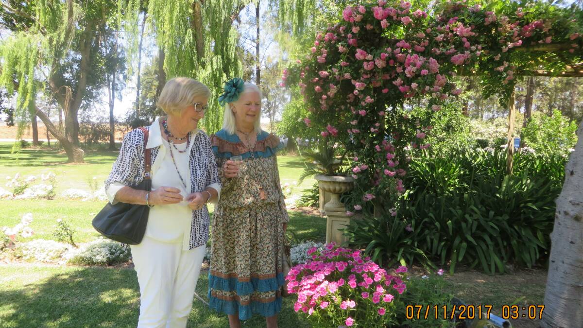 Blooming Beautiful:  Patricia Irving and Judie Sturtevent from Warren admire the magnificent blooms in the ‘Karamea’ garden .