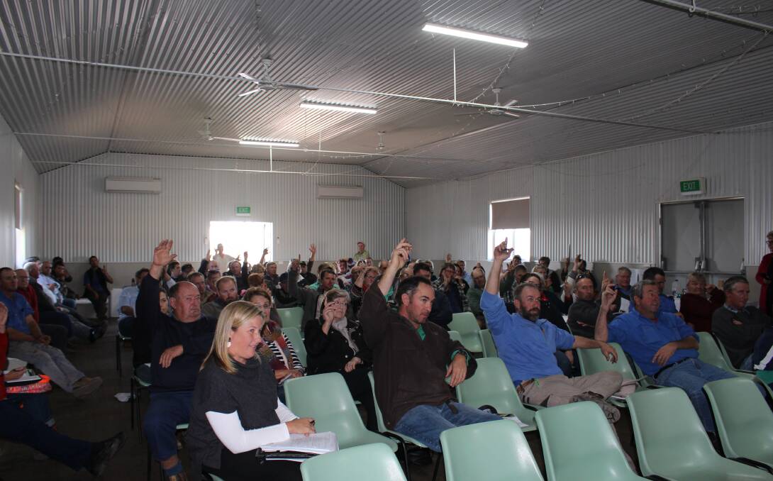 At a meeting in Curban last week, farmers vote to request an inquiry into how the Inland Rail route between Narromine and Narrabri was determined. Photo courtesy The Coonamble Times. 