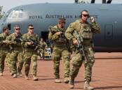 Australian Army Soldiers from 1st Battalion, Royal Australian Regiment exit a No 37 Squadron C-130J Hercules after arriving at RAAF Base Scherger in 2017. Picture: Department of Defence