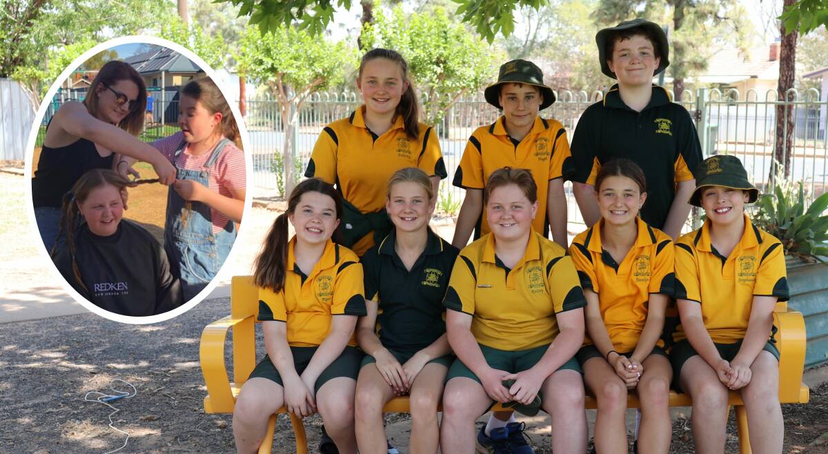 SUPPORT: Year 6 St Augustine's student Kelsey Neve (front, middle) has cut her locks to be donated to the Australian Alopecia Foundation, to make wigs for kids. Photo: ZAARKACHA MARLAN