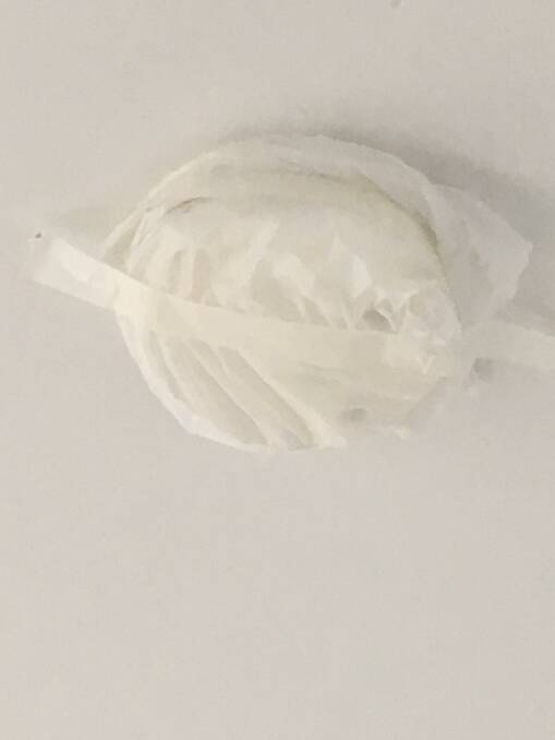 A resident in a rental apartment noticed the smoke alarm was taped up.