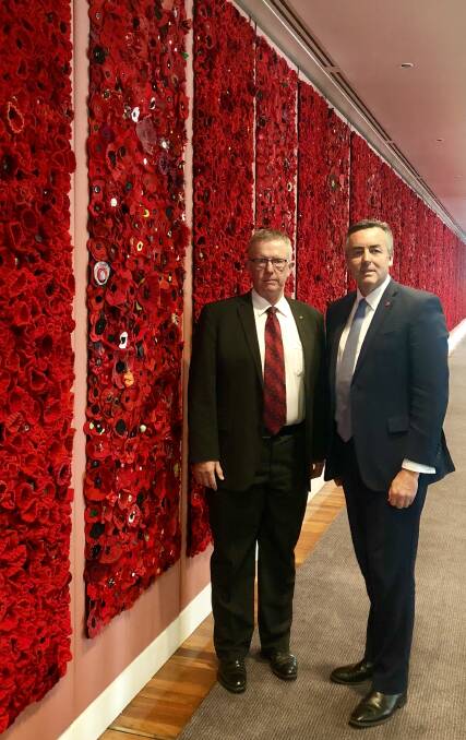 Member for Parkes Mark Coulton with Minister for Veterans’ Affairs, Darren
Chester, at a special installation of handcrafted red poppies in the marble foyer at Parliament House to commemorate the Centenary of Armistice.