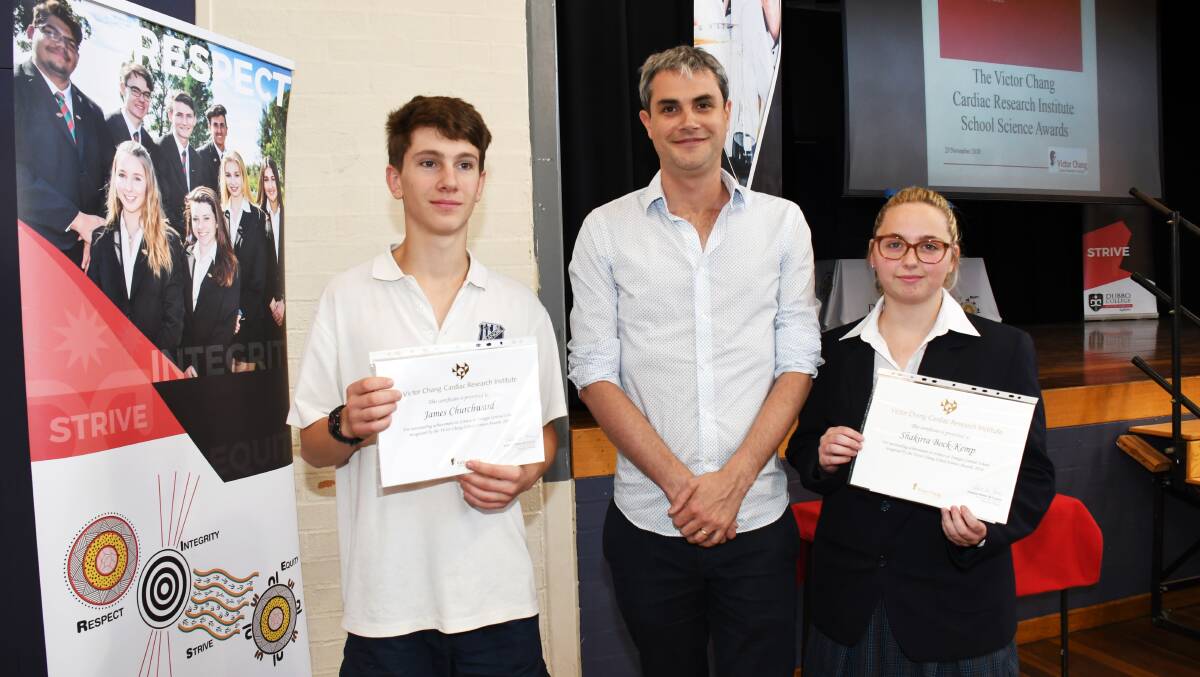 DEDICATION: Trangie Central School students James Churchward and Shakirra Bock-Kemp with Dr Alastair Stewart from the Victor Chang Cardiac Research Institute (middle). Photo: Belinda Soole.
