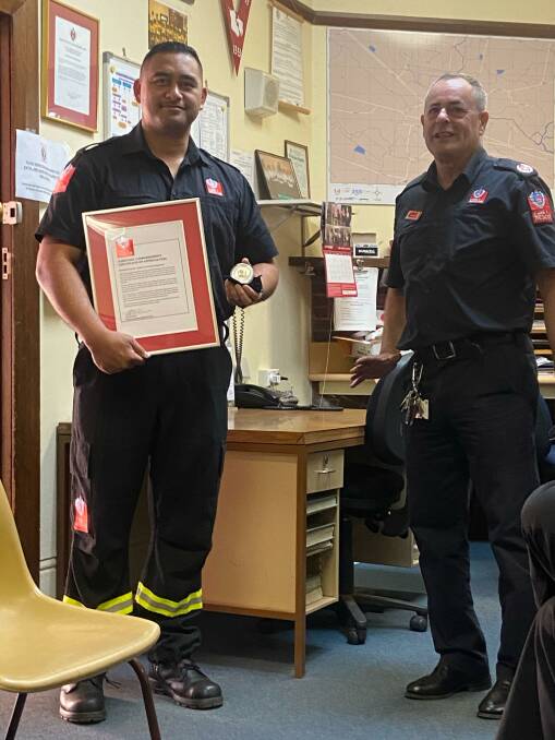 MERIT: Narromine FRNSW retained firefighter Penford Feo accepting the award from assistant FRNSW commissioner Rob McNeil. Photo: CONTRIBUTED