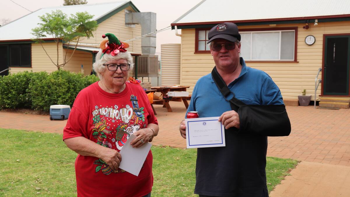 CHEER: Hermidale CWA President Margaret Gudgeon with President of the Narromine Men's Shed and Central West Riders committee member, Ivan Littlehales. Photo: ZAARKACHA MARLAN