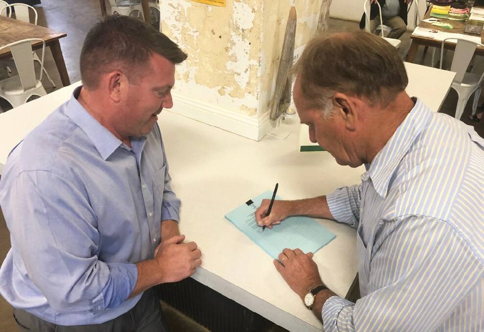 Narromine Shire Mayor Craig Davies is the first signature on the petition to improve the Mitchell Highway between Narromine and Dubbo. 