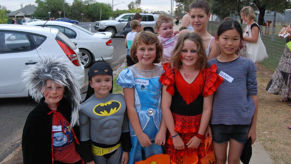 SCARY: Simon, Austin, Annalee, Stacey and Rachel with Tiana and Jasmine (back) trick-or-treating in Trangie. Photo: NARROMINE NEWS