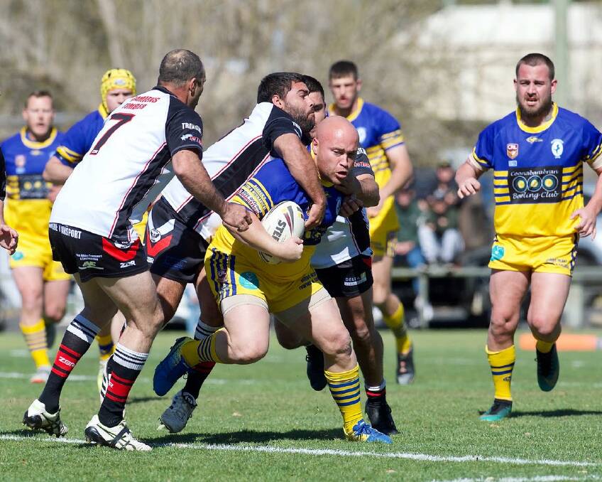 Coonabarabran second rower PJ Stanton is wrapped up by the Trangie defence. Photo: Peter Sherwood Photography