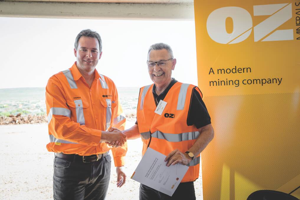Former deputy chairman of Kokatha Aboriginal Corporation Chris Larkin, right, shakes hands with managing director and chief executive officer of OZ Minerals Andrew Cole in 2016. 
