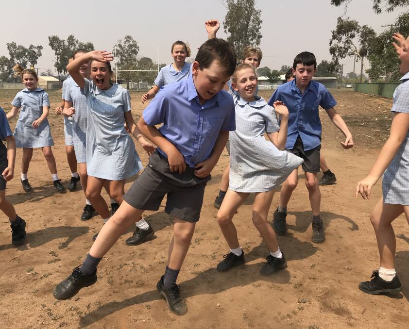 LET'S RAINDANCE: Students from St John's Parish Primary School at Trangie will dance up a storm on December 13 and are hoping schools across Australia will join in.